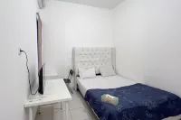 RedLiving Apartemen Eco Home - Wieg's Room Tower B Yashinoki Hôtels à : Sindang Jaya
