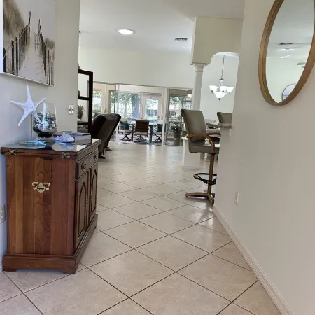 Great location..Climate-controlled lanai & NEW 2024 4-SEATER GOLF CART INCLUDED!