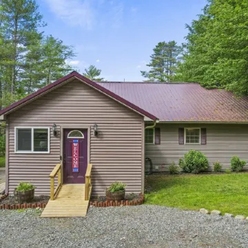 Quiet lake front home with private beach