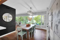 Mid-Century Boho Chic home with Pool, Game Room & Outdoor Playhouse.