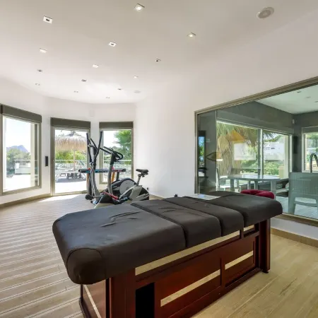 Large modern villa with indoor and outdoor pool sauna and bar.