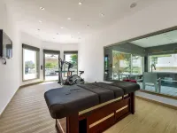 Large modern villa with indoor and outdoor pool sauna and bar.