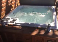 Secluded mountain top cabin with amazing views and hot tub!