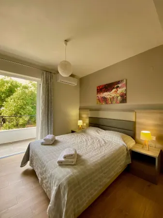 Eirini & Manolis Apartments Отели в г. Agios Vasileios