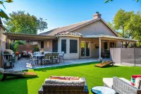 Expansive Backyard Oasis with Pool and Waterslide - Inviting Escape