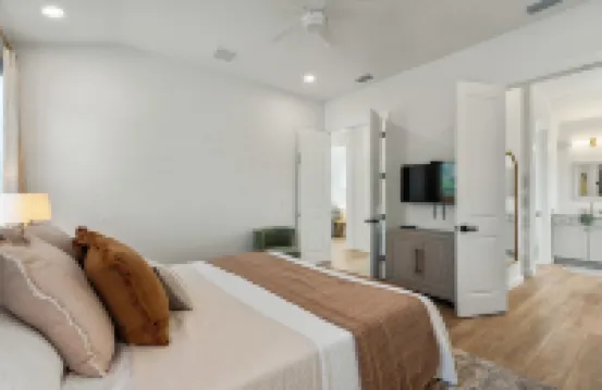 BRAND NEW 4-bedroom, 2 primary suites, heated pool, steps to the beach and river