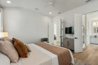 BRAND NEW 4-bedroom, 2 primary suites, heated pool, steps to the beach and river