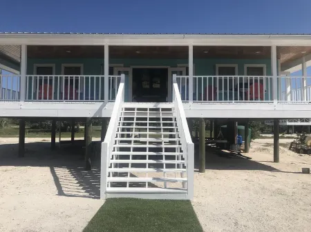 NEW RENTAL!!! Conch Heaven is a four bedroom house on a canal with a dock.