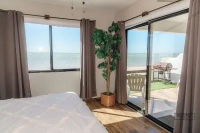 Oceanfront ground level condo on a Private Beach in a lovely resort!