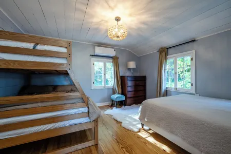 Golf, Fish, Boat, Relax, Repeat! 4-bed, 2-bath house steps away from the lake.