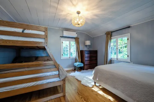 Golf, Fish, Boat, Relax, Repeat! 4-bed, 2-bath house steps away from the lake.