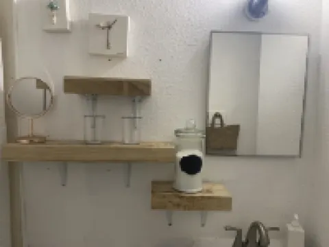 Cozy retreat half a mile away from the Beach set amidst peaceful tropical garden