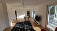 Modern, newly built vacation apartment with large covered balcony and view Hotel a Wilnsdorf
