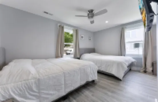 Stainless Steel Appliances and Flat-Screen TV - Modern Coastal Retreat