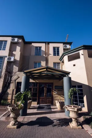 Airport Inn and Suites Отели в г. Кемптон Парк