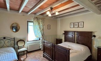 a bedroom with two beds , one on the left and one on the right side of the room at Hotel Airone