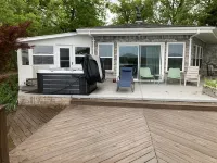 Spectacular lake view with a huge deck and a Hot Tub.