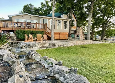 Lakefront cabin, large private dock, & flat backyard oasis. Panoramic views!