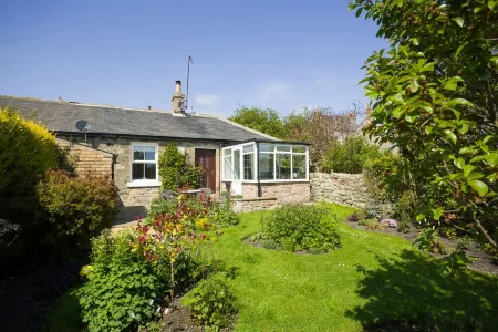 Cosy cottage with delightful private garden and summerhouse.
