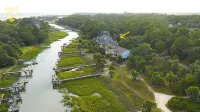 Spectacular 5-Star on the creek home, 6 cards and Golf Cart with full week stay