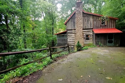 Robin's Nest is an authentic log cabin built with hand-hewn logs from the 1800's