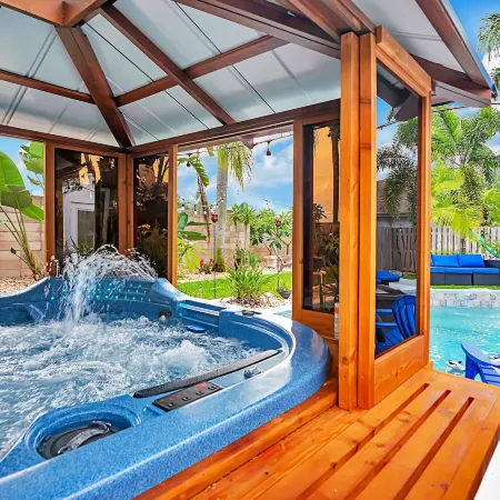 Urban Oasis W/Hot Tub, Heated Pool and Private Movie Theater 2 Bedroom Home by RedAwning