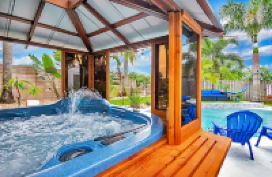 Urban Oasis W/Hot Tub, Heated Pool and Private Movie Theater 2 Bedroom Home by RedAwning