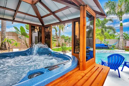 Urban Oasis W/Hot Tub, Heated Pool and Private Movie Theater 2 Bedroom Home by RedAwning