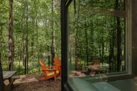 Serene Outdoor Seating and Modern Amenities - Luxurious Enchanting Cabin