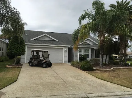 Bright Coastal Decor and Golf Cart - Inviting Luxury Retreat