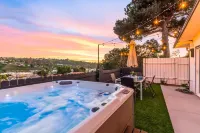 Breezy dog-friendly house with hot tub, central AC, game room, & washer/dryer