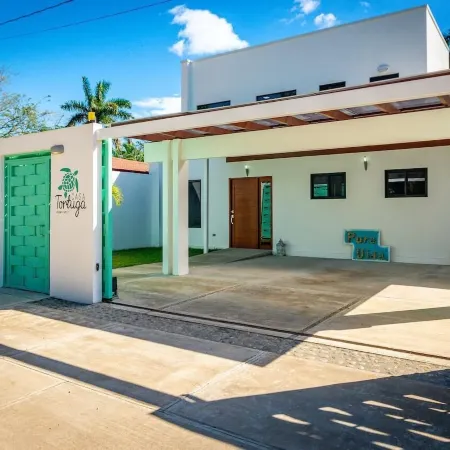 Ultramodern Townhome with an Inviting Coastal Design and Lush Outdoor Oasis with a Private Pool