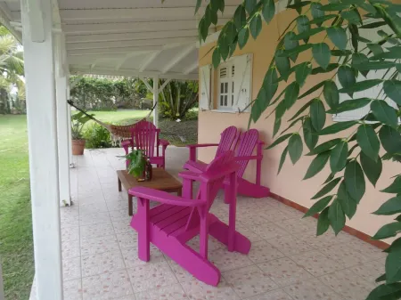 F2 Bottom corner villa with veranda and trees