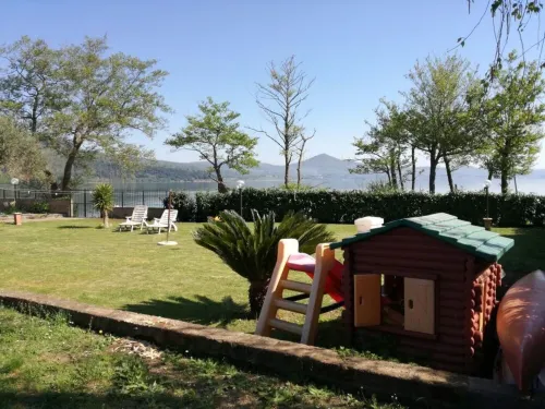 Independent villa with private beach on the lake
