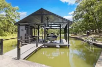 Richland Chambers Lakefront 2-story home with boat dock and pavilions.
