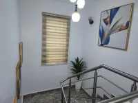 Cozy 2-bedroom bnb in beautiful Palmgrove Estate Ilupeju Lagos with AC & WiFi Hotels in Mushin