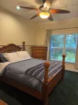 Escape to this serene 4-bedroom home set on 10 private acres.
