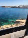 Seafront apartment in welcoming Marsaskala with fully AC, WiFi. Sleep up to 6!