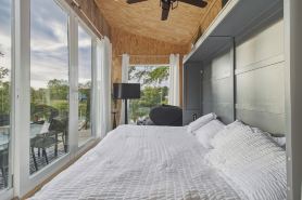 Unplug and unwind in this charming loft cabin nestled on the water’s edge.