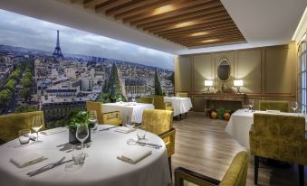 The restaurant offers a scenic view of the city from an elevated position above a filming location at Sofitel Saigon Plaza