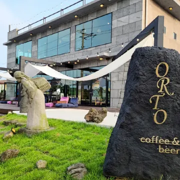 Jeju Orto Pension and Guest House Отели рядом с достопримечательностью «Храм Понвонса»