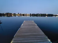Lakefront Getaway. Private Waterfront Home with Dock and Sunroom.