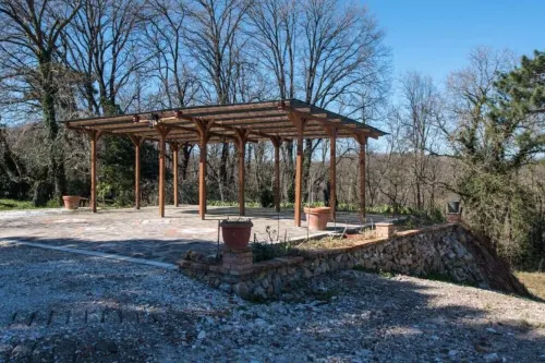 Detached cottage in a park-like garden overlooking the pool Hotel a Fauglia