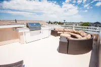 Seaside Beach Mansion w/9 Bedrooms, 8 Full Baths, Pool, Elevator & Rooftop Deck.