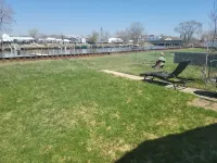 Waterfront with Boat Dock on Detroit River Channel. Fish from the Backyard