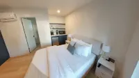 Charming Kitchenette and High-Speed Wi-Fi - Inviting Urban Retreat