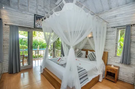 221 Garden Cottages Отели рядом с достопримечательностью «Twin Island Dive»