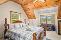 Enchanting 5-Bed/5-Bath Lakefront Log Cabin with Private Cove, Beach & Hot Tub.