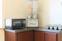 The Symphony Inn & Suites Hotels in Meadows Place