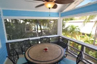 Oceanfront beach house with dual-masters & screened balcony on West Bay Beach